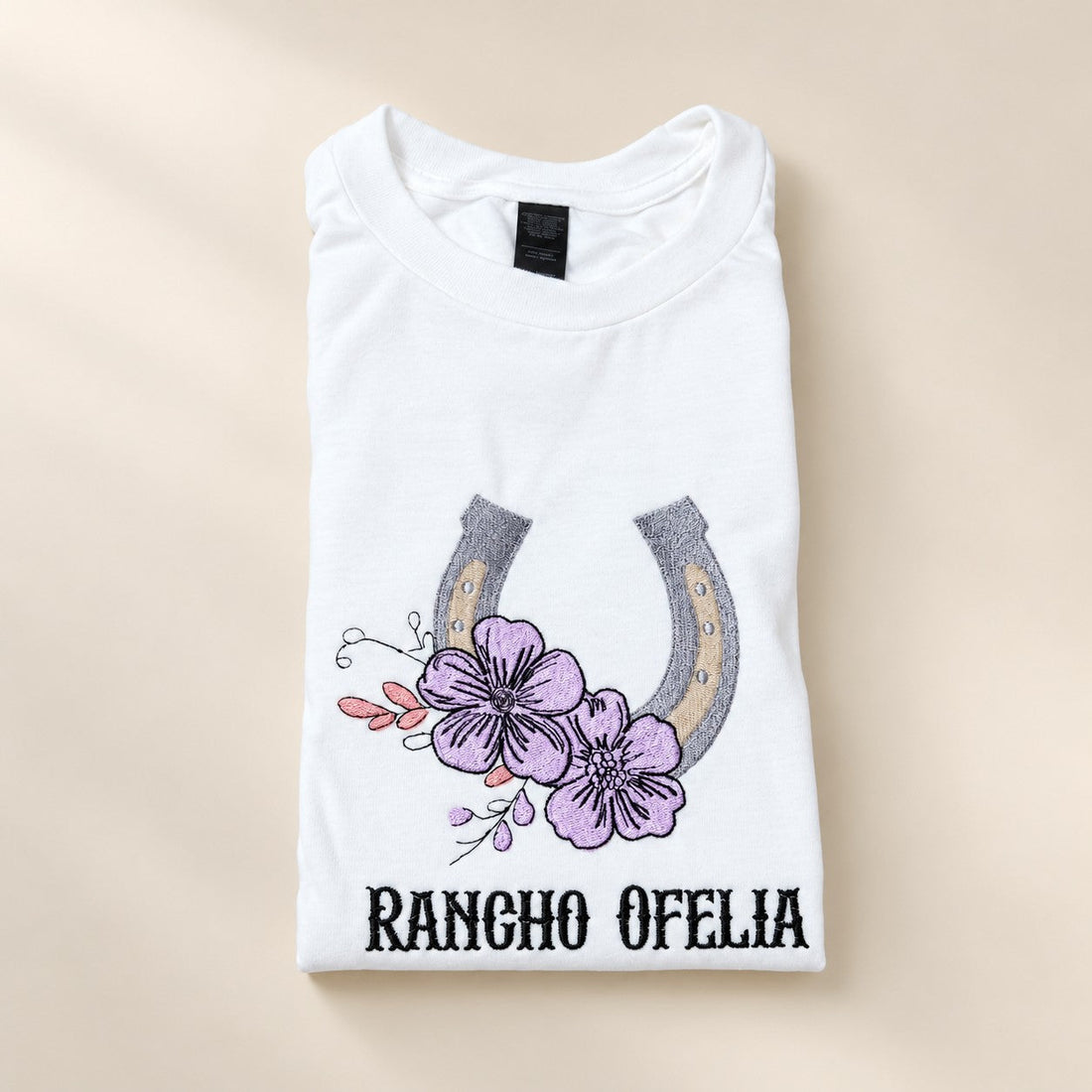 Ranch logo embroidered on a custom work tee