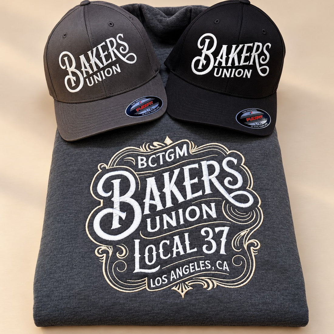 Custom embroidered union logo on a sweatshirt and matching caps